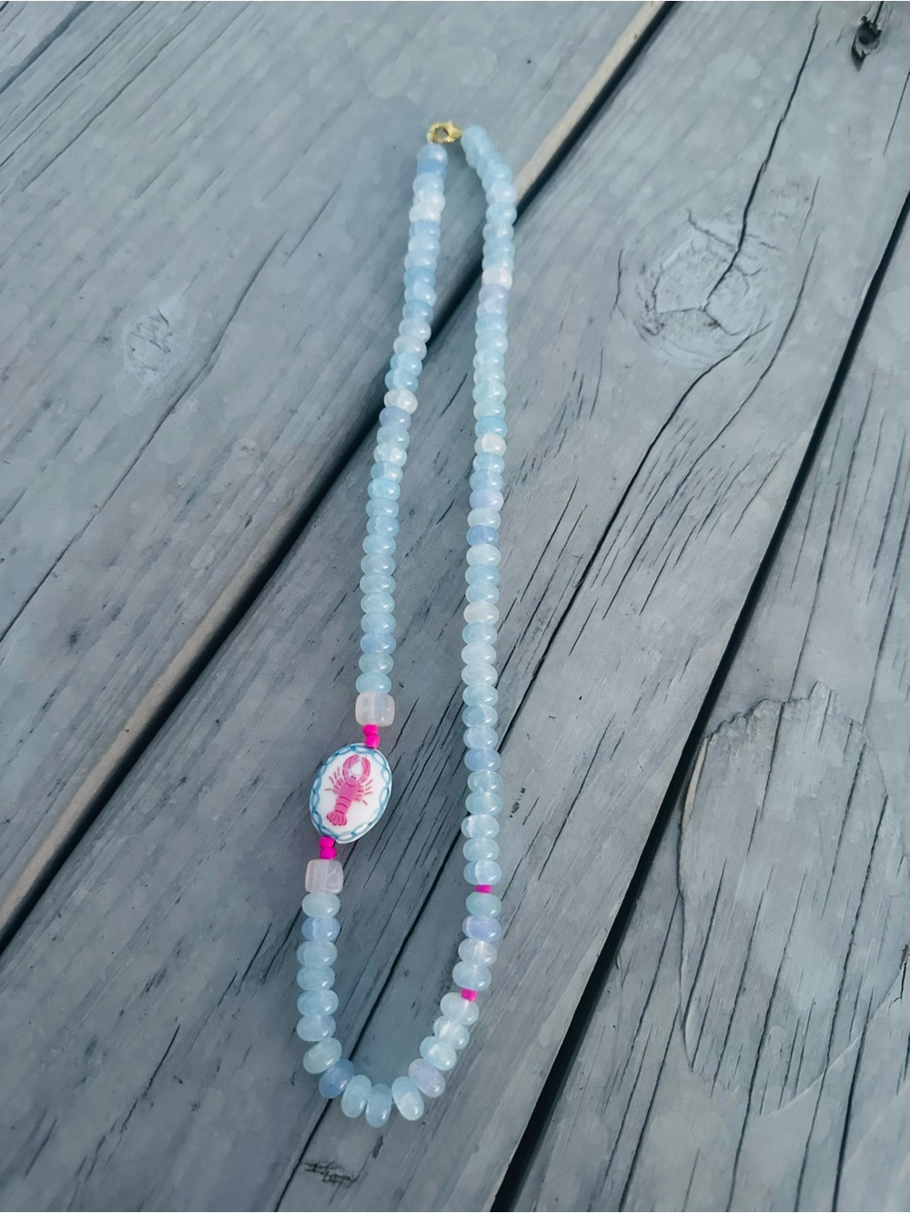 Light Blue Beaded Necklace with Pink Lobster Accent